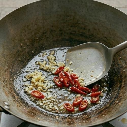 Step 3: Sauté Garlic and Chilies